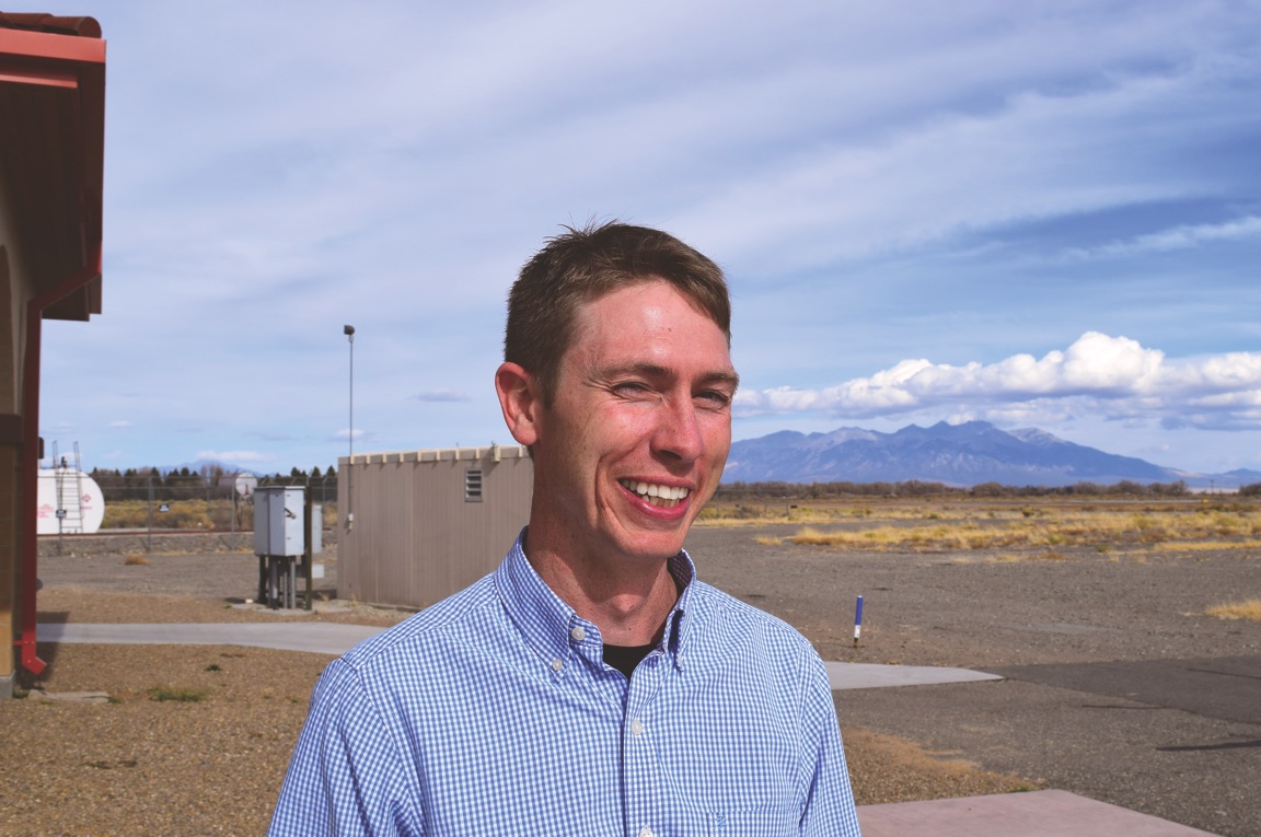 San Luis Valley Regional Airport Manager Dustin Allinger, 36, stands outside of the terminal. He's been working at airports for 11 years.