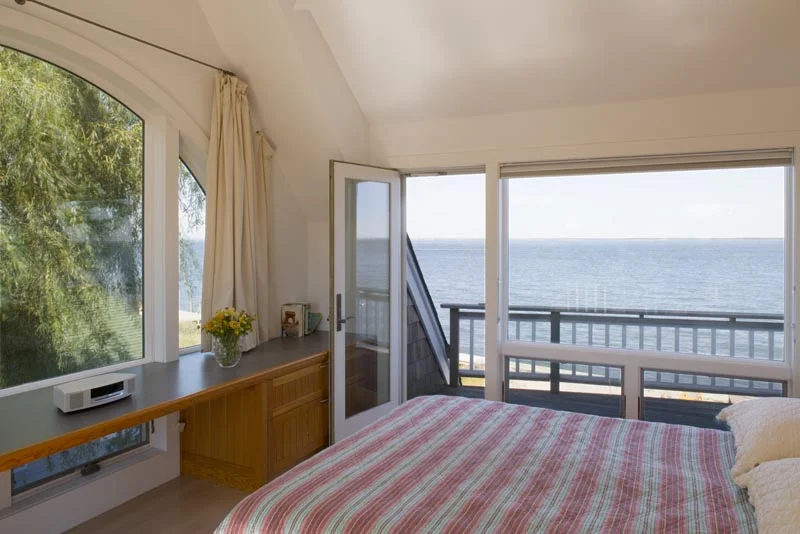 This Private Residence is a new 2,100 square foot two-story residence with spectacular views of the Bay from every room. The house features an open plan with a pool, sundecks, and multiple outdoor spaces from each bedroom. Maintaining the existing vernacular of the island, the Shingle Style house is surrounded by lush landscaping creating a hidden oasis along the Bay. The house consists of a main L-shaped volume, which wraps around the exterior terrace and pool deck. The stair is enclosed in a dramatic tower off the entry allowing natural light to filter through to each level.