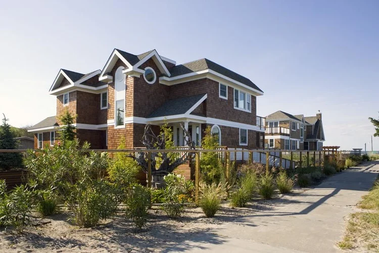 This newly constructed 2,500 square foot house is situated along the Bay in Fire Island. Comprised of two-stories, a pool, and multiple levels of sundecks, the house is situated to take advantage of the impressive water-side views. The traditional Shingle Style house consists of a main rectangular volume, which contains the 16-foot high living/dining space with views to the bay in the distance. At the lower level the family room and kitchen overlook the pool entry. Natural light is captured through the expansive windows in the main space, while maintaining a level of privacy.
