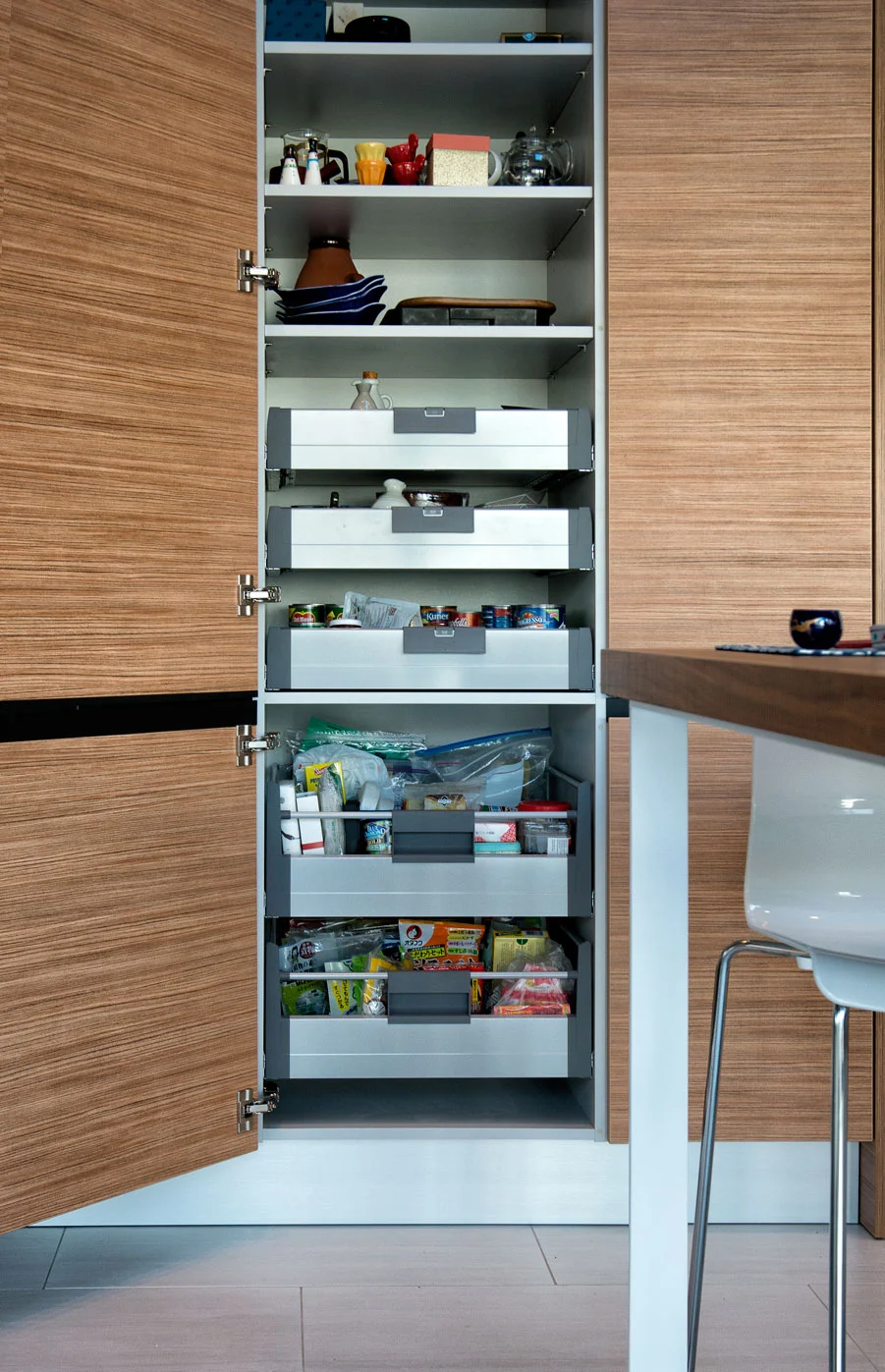 project details: white matt lacquer european textured melamine snow white krion tops matt glass back-splash veselbrand " stick " tall pulls Blum servo hardware / uppers vertical grain fir wall panels miele appliances