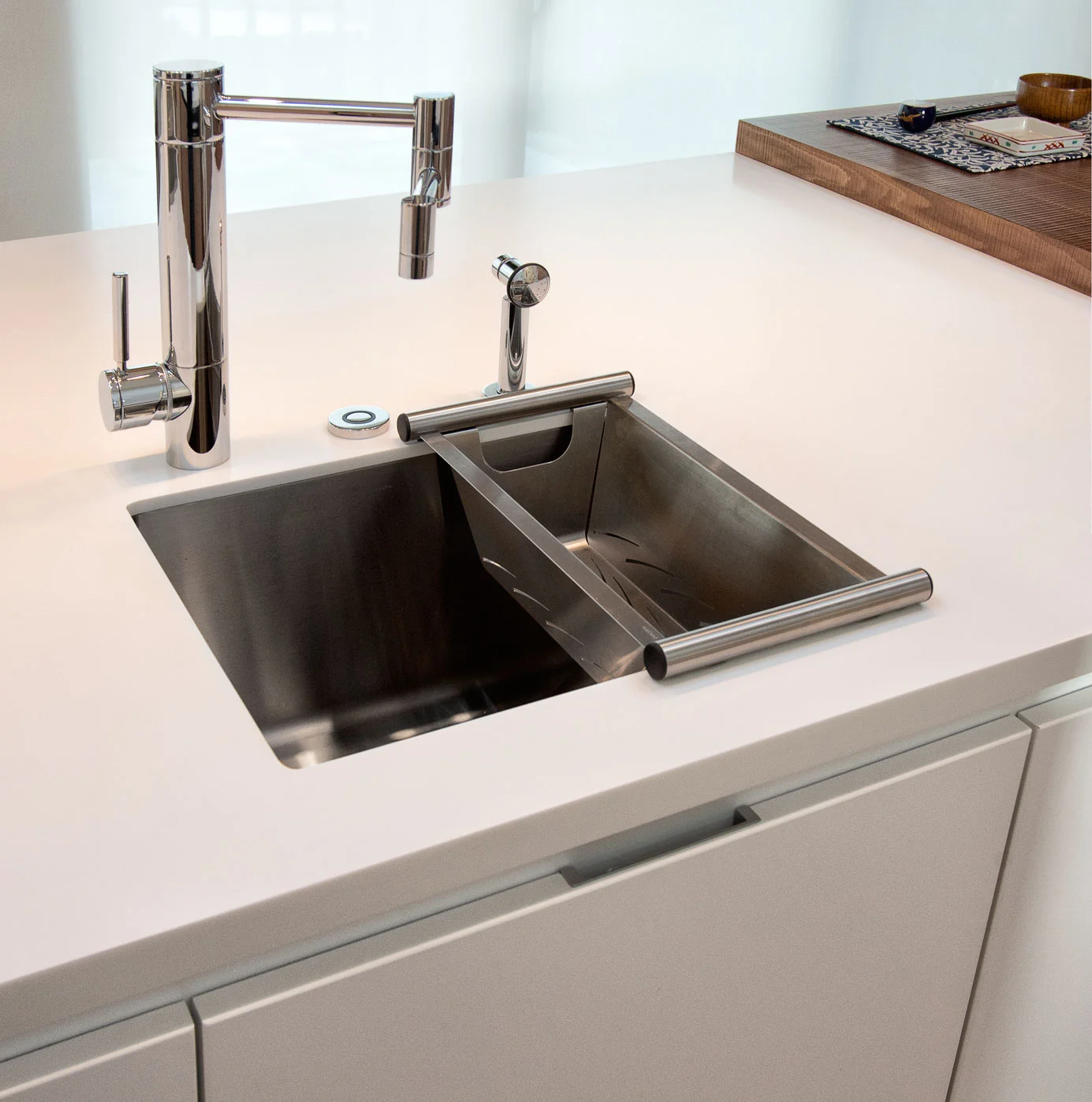 project details: white matt lacquer european textured melamine snow white krion tops matt glass back-splash veselbrand " stick " tall pulls Blum servo hardware / uppers vertical grain fir wall panels miele appliances