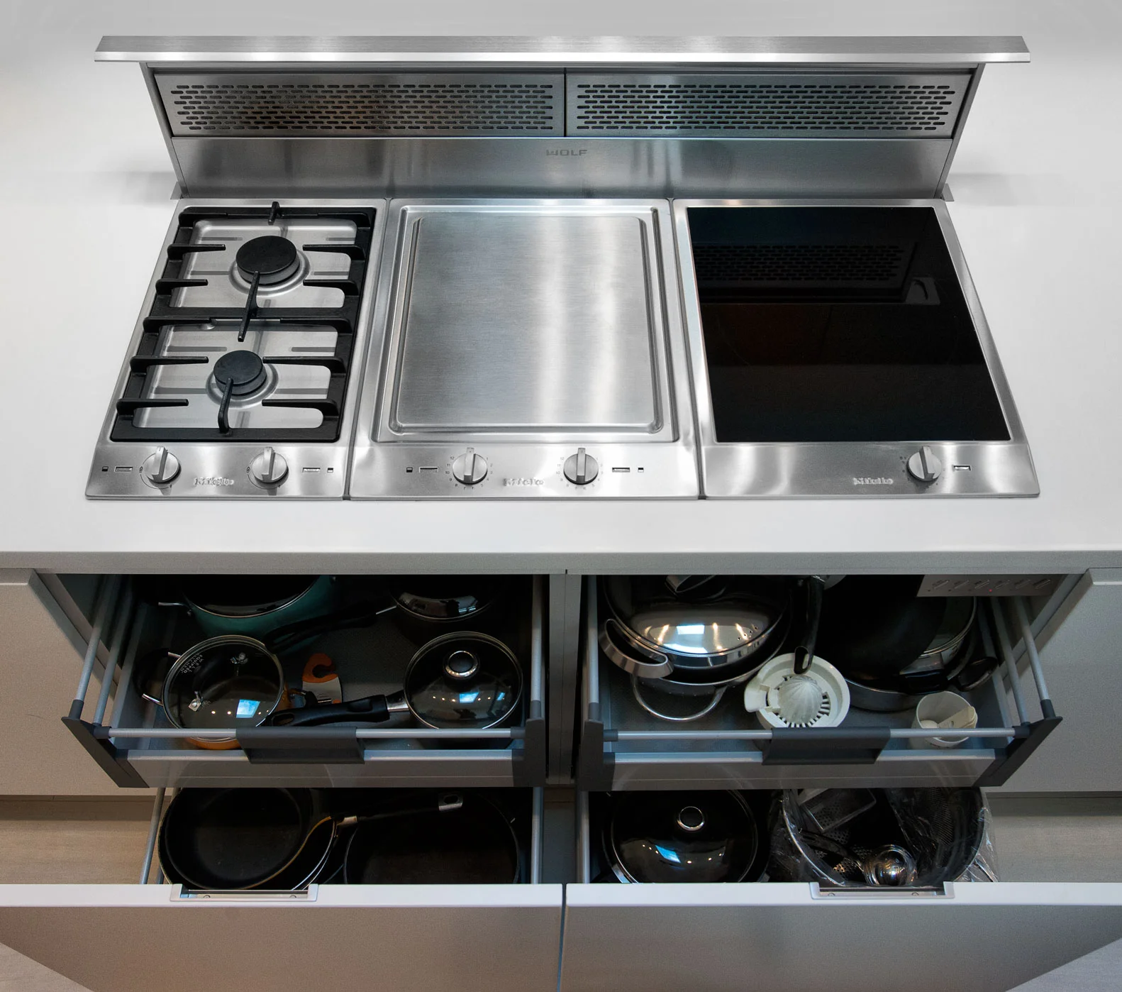 project details: white matt lacquer european textured melamine snow white krion tops matt glass back-splash veselbrand " stick " tall pulls Blum servo hardware / uppers vertical grain fir wall panels miele appliances