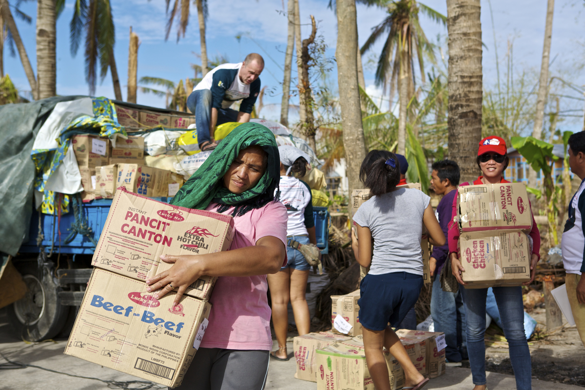 Relief goods being offloaded and distributed in Dunganon Bank, Bantayan Island to victims of Typhoon Yolanda. Photo: Steve de Neef