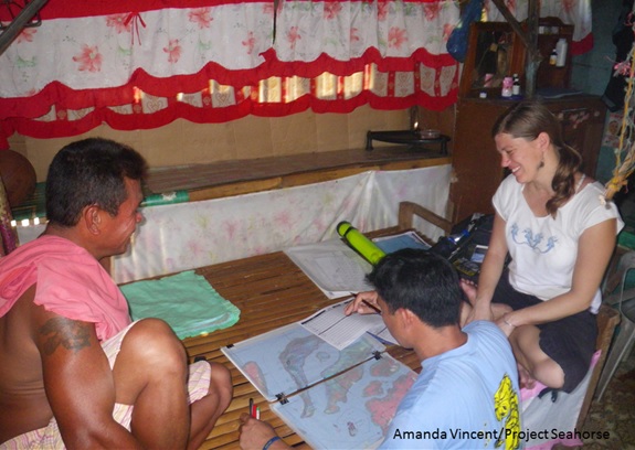 Researcher Jenny Selgrath mapping a rare coral reef with local fishers. Amanda Vincent/Project Seahorse