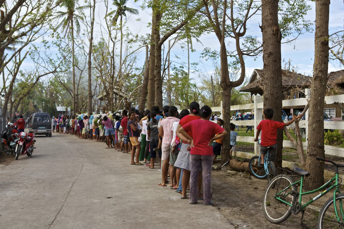  People waiting in line in Dunganon Bank, Bantayan to receive relief goods. This can take hours. Photo by Steve de Neef