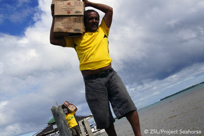 Volunteers unload the supplies. 