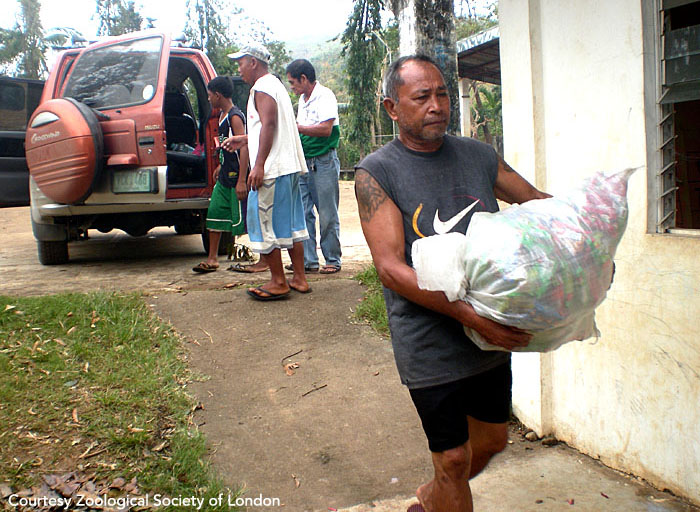 A barangay captain (village head) helps with the relief effort. Panay, Philippines. Photo courtesy of ZSL