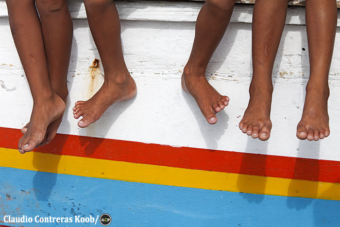 Kids idling on a boat.