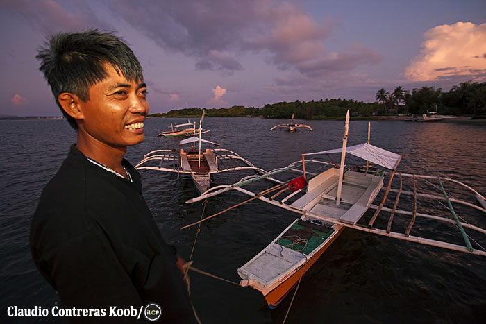Outrigger pump-boats at dusk.
