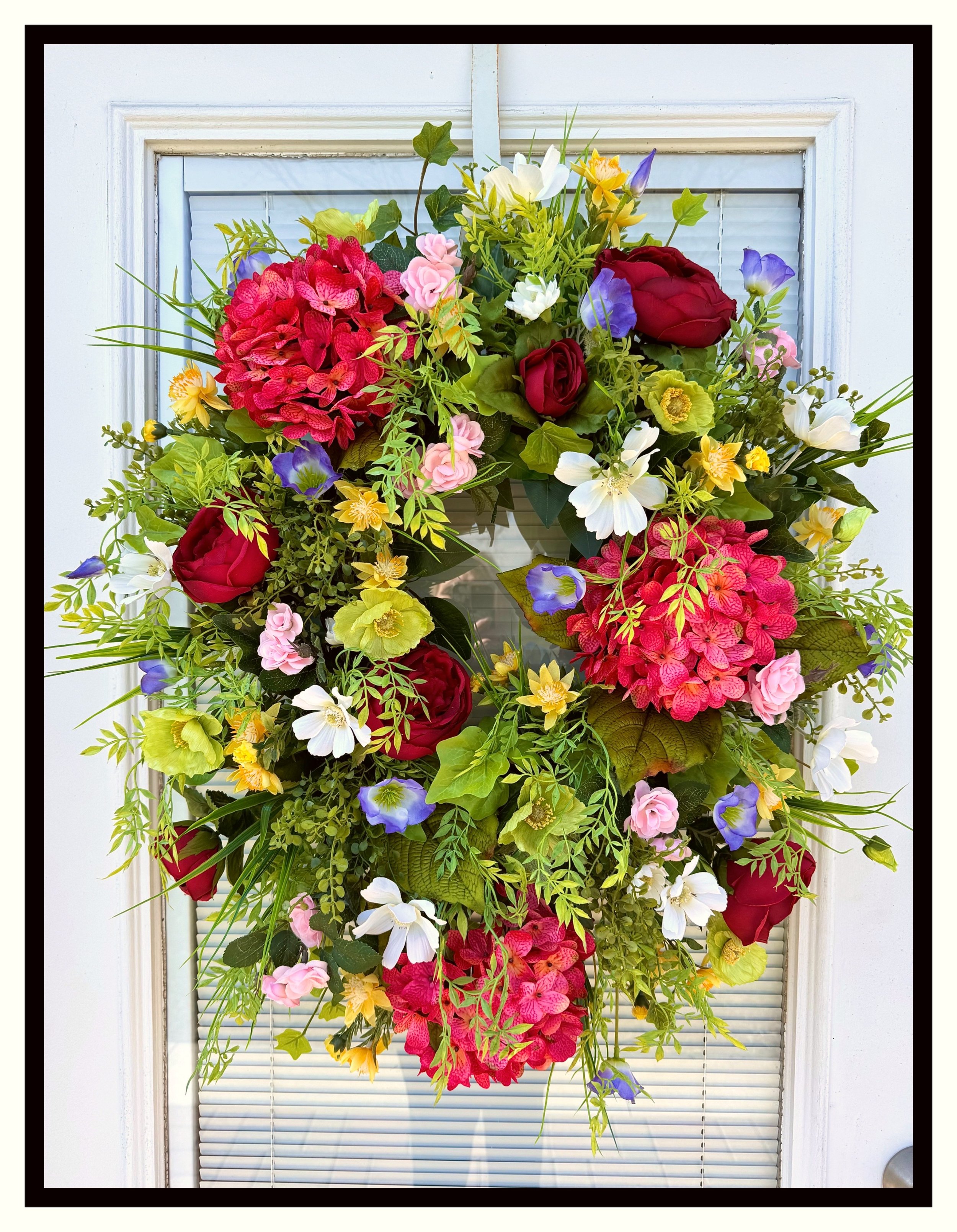 vibrant floral grapevine wreath raspberry hydrangeas red cabbage roses green poppies white cosmos
