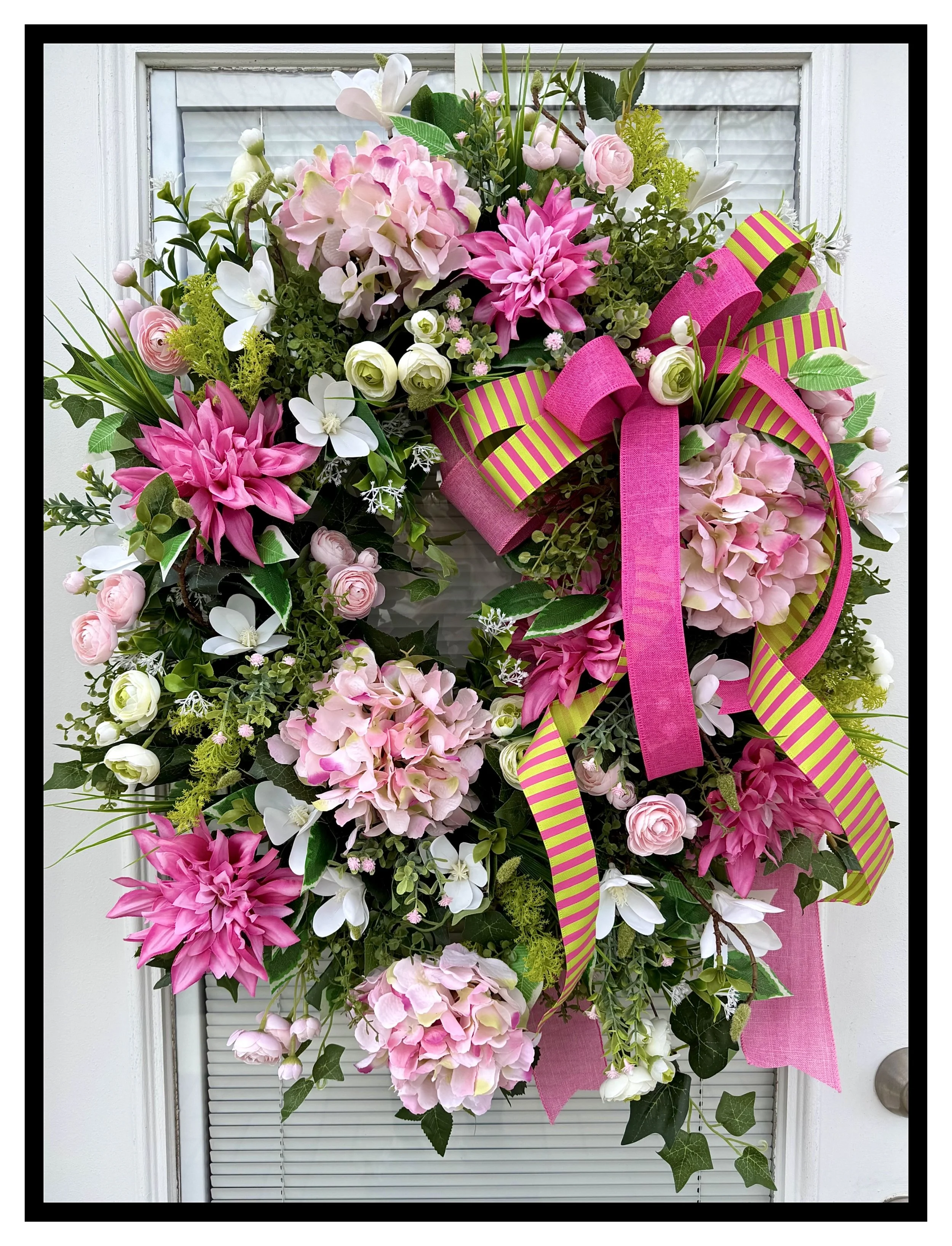 large floral wreath light pink hydrangeas dark pink dahlias white magnolias