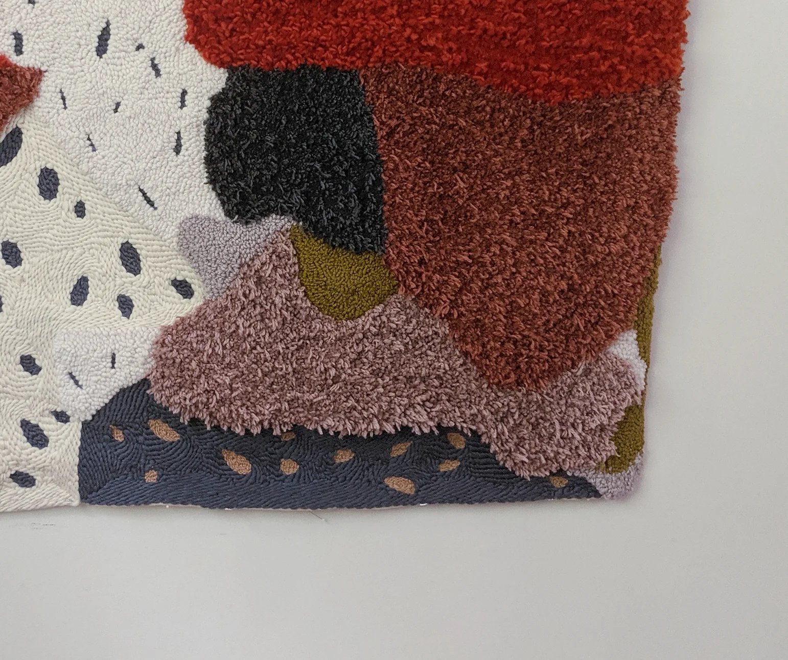 Tabernacle , detail. 2019 Hand-punched and machine tufted using a mixture of relcaimed and American wool yarns on cotton fabric.