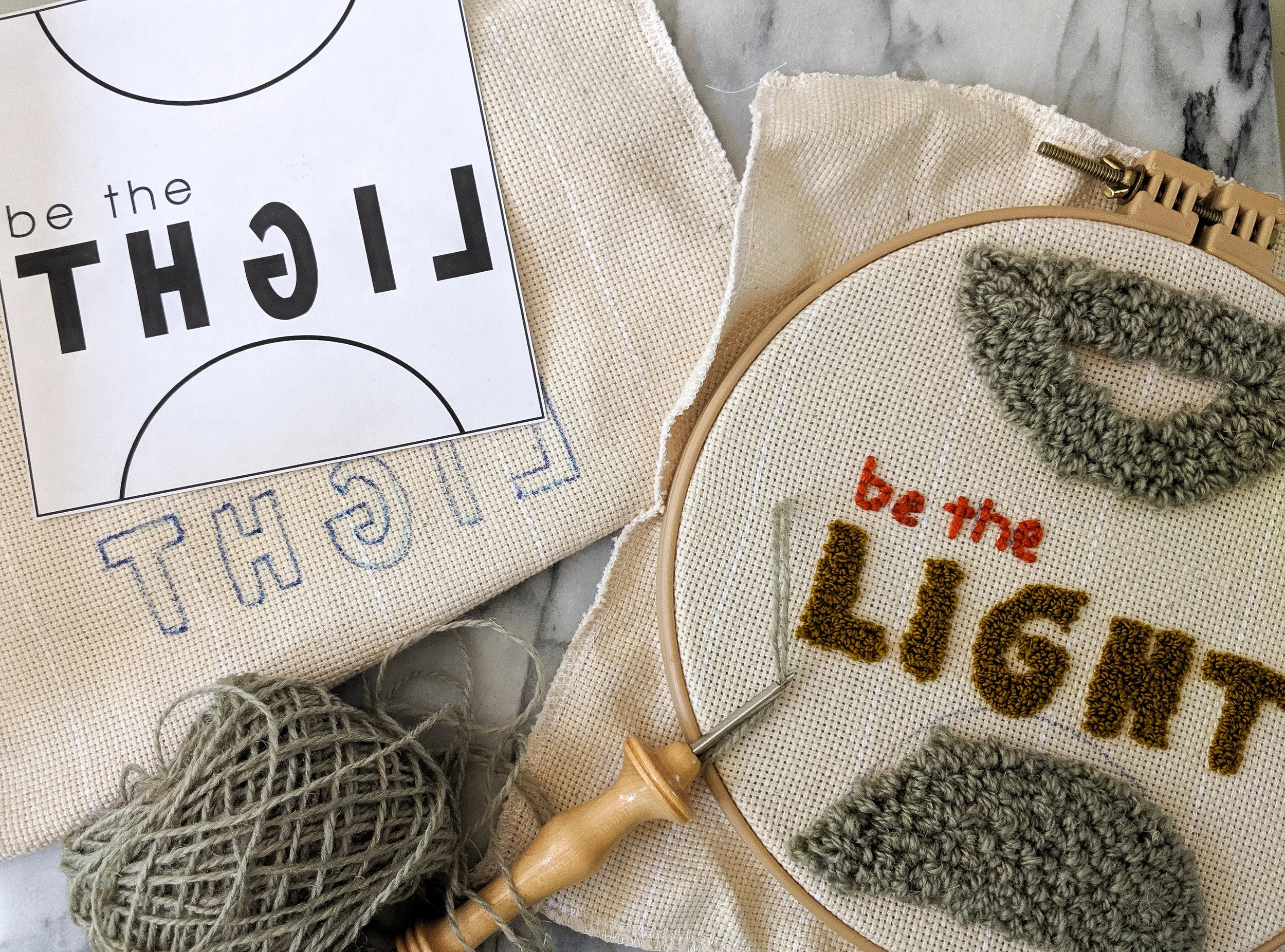 I wanted the word “light” to be created with a loop pile. This means that I had to trace out the word “light” on the back side of my foundation cloth backwards in order for it to be legible on the other side.