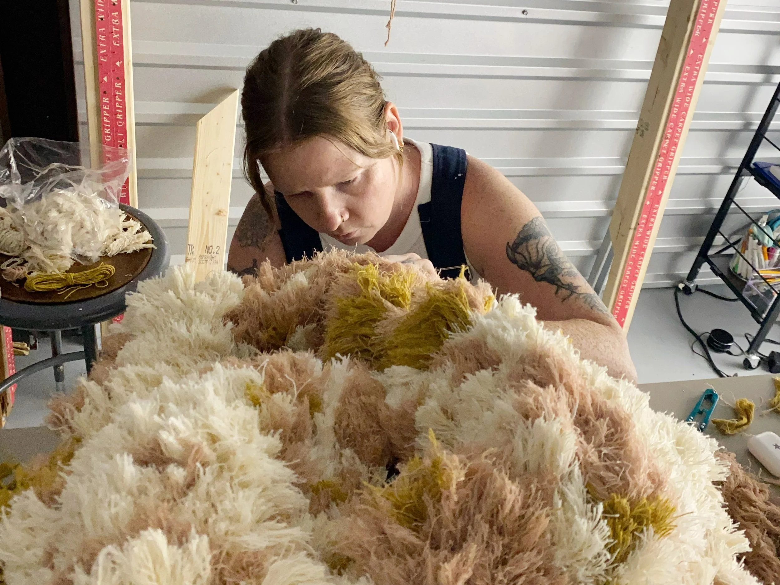  Attaching fringe to the first piece in the  Overwhelm  series. 