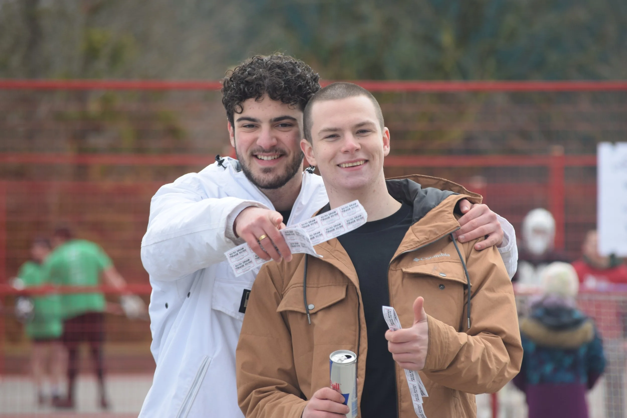 Brothers Enzo Passarini (PA ’22) and Callum McPhee (PA ‘22) selling 50/50 raffle tickets at the Scott Trapp Stick-It to Cancer Memorial Ball Hockey Tournament; ∆KE's signature annual philanthropy event
