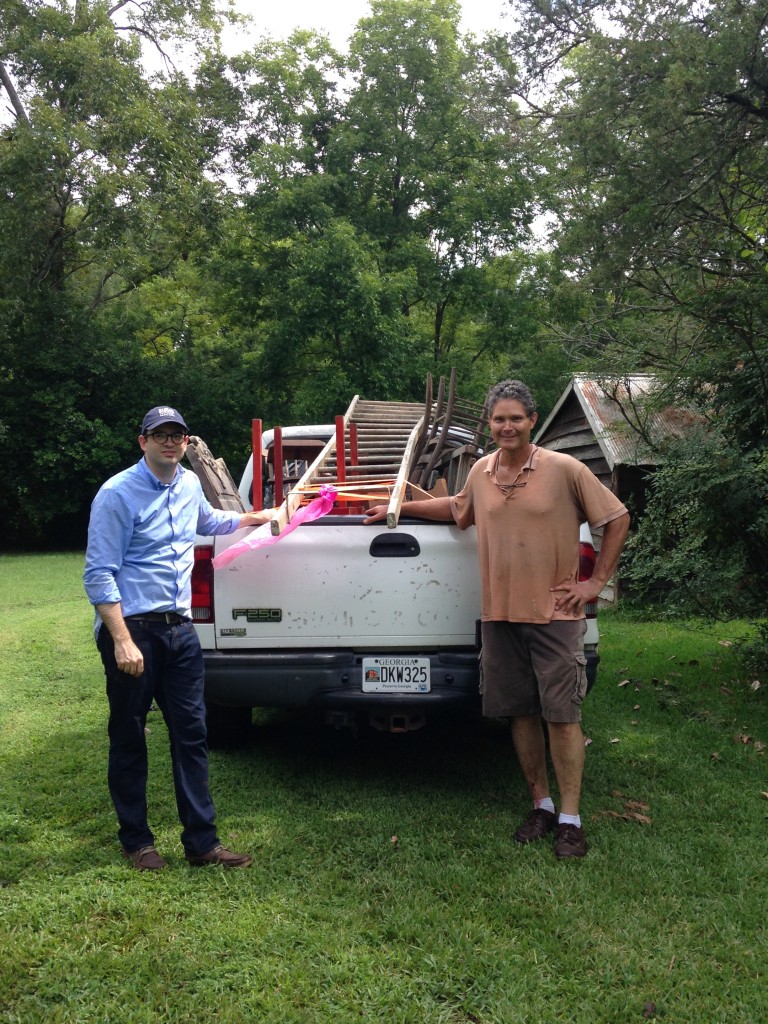 Ethiel, HMF director, and Jim pose with the Historic Macon truck after a few hours of treasure hunting.