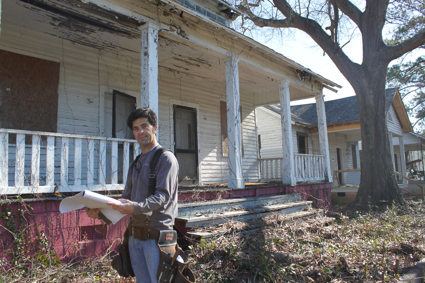 Michael Phillips, Historic Macon's Preservation Carpenter, prepares for work in Mill Hill