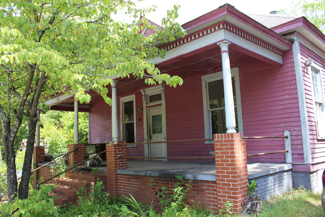 The John B. Brooks House sits on land originally known as the J.P. Lamar Sr. property in the Vineville Historic District. Built in 1908, it is indicative of the type of houses built in Vineville during the early twentieth century. The Brooks family enjoyed the beautiful features of this house from 1908 until 1953. During that time, the family received quite a bit of attention in the Macon Telegraph . Shortly after building this house, John Brooks appeared in court as a defendant for distilling whiskey. The City of Macon and Bibb County began establishing prohibition laws before the Prohibition Act of 1921, and James Brooks was in violation of those laws as early as 1916. Not all the coverage the family received was negative, however. John Brooks’ daughter, Eva Mae Brooks, was nominated as one of the most popular young ladies in town during a vote held in the Macon Telegraph in 1933. John Brooks’ son, James, fought during World War II, rising to the rank of corporal in the 770th Field Artillery Battalion. After the Brooks, various owners and tenants resided in the house over the years. In 2007, Lamar Street Limited, LLC acquired the property along with many others along Lamar Street. The John B. Brooks House is in danger of DEMOLITION BY NEGLECT. As a contributing structure in the Vineville National Register Historic District, it is eligible for preservation incentives and is calling out for a new family to move in and make it home. The solution for the John B. Brooks House is rehabilitation by a sensitive new owner.