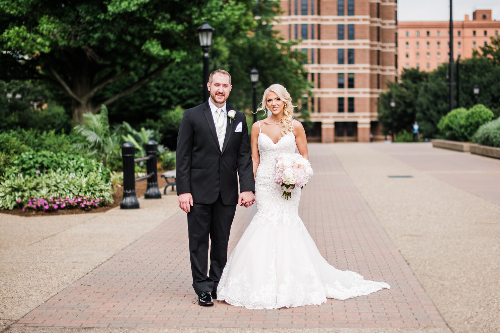 The bride and groom stopped for a posed shot at Duquesne University on the day of their wedding.