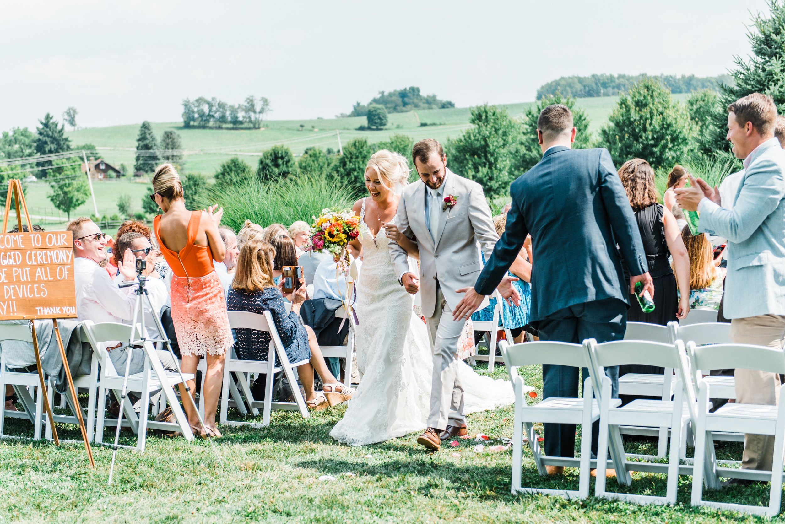 bride and groom walk down the aisle