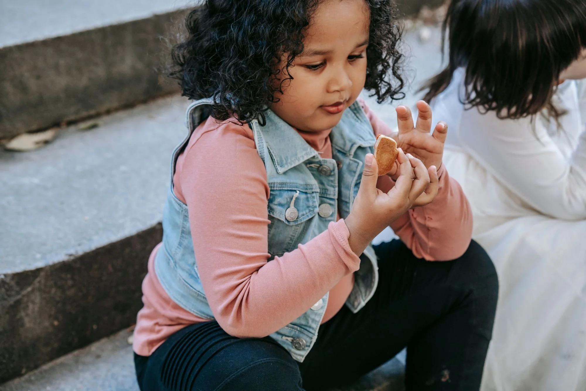 autistic child inspecting food