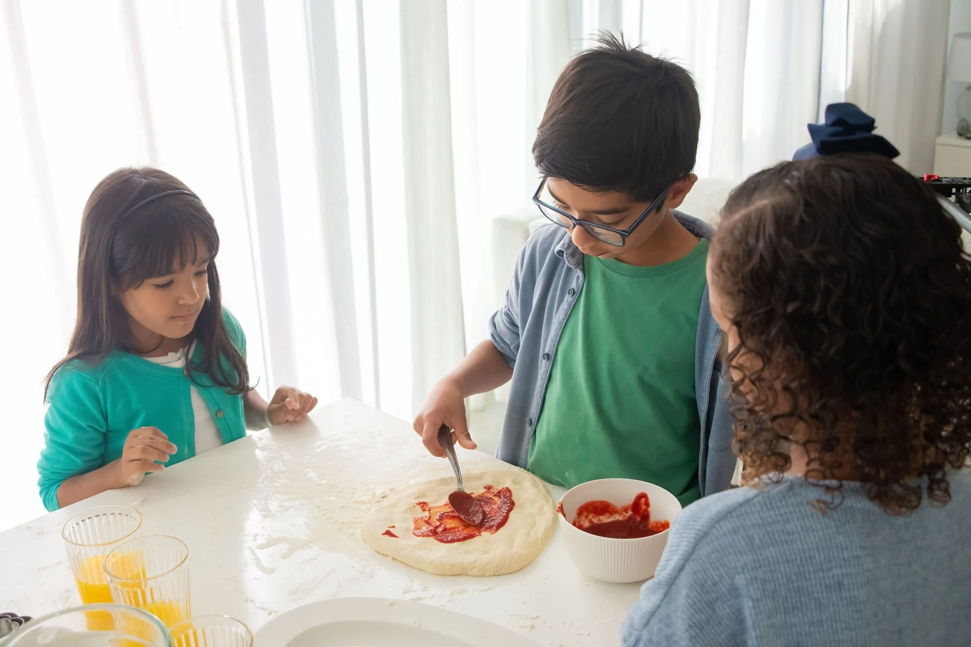 neurodivergent children making pizza advised by nutritionist and dietitian