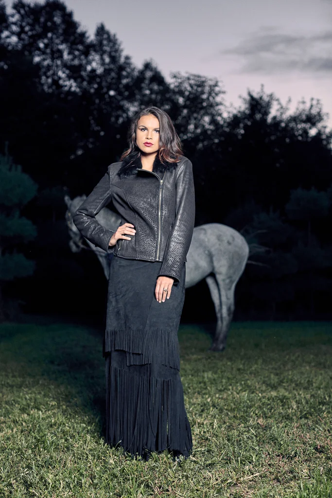 DISTRESSED LEATHER MOTO JACKET WITH SHEARLING COLLAR $1,395 LONG BLACK GOAT SUEDE SKIRT WITH WIDE LEATHER WAIST BAND $1,300 ALL CUSTOM MADE-TO-ORD ER