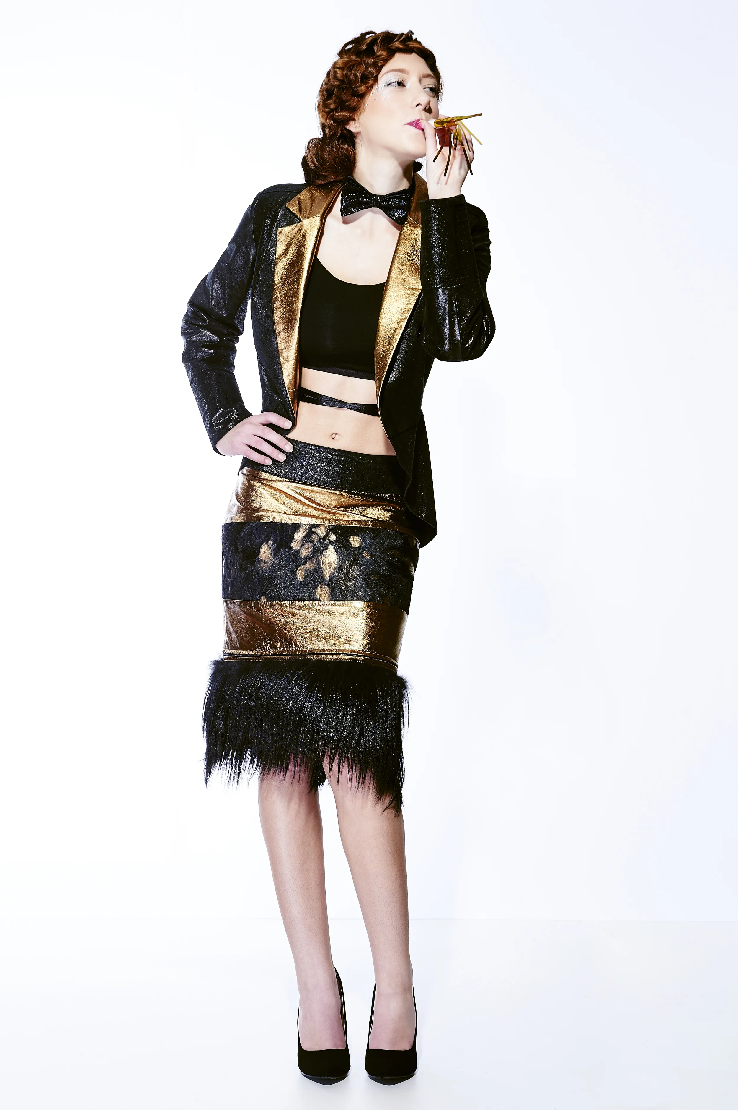 WOMEN'S TUXEDO JACKET IN BLACK SHIMMER SUEDE & BRONZE LAMBSKIN $1,350 BLACK/BRONZE ACIDWASH COWHIDE PENCIL SKIRT WITH REMOVABLE GOAT FUR HEM $850 BLACK SUEDE SNAKE PRINT BOWTIE $95