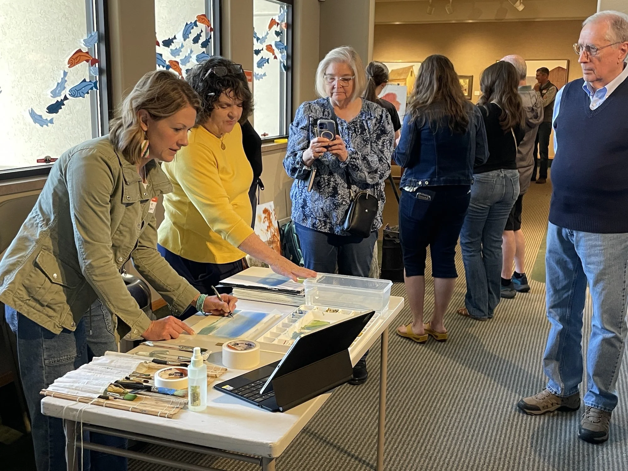 Artist Allie Zeyer at the Art Museum of Eastern Idaho Sacred Spaces exhibition, May 2026