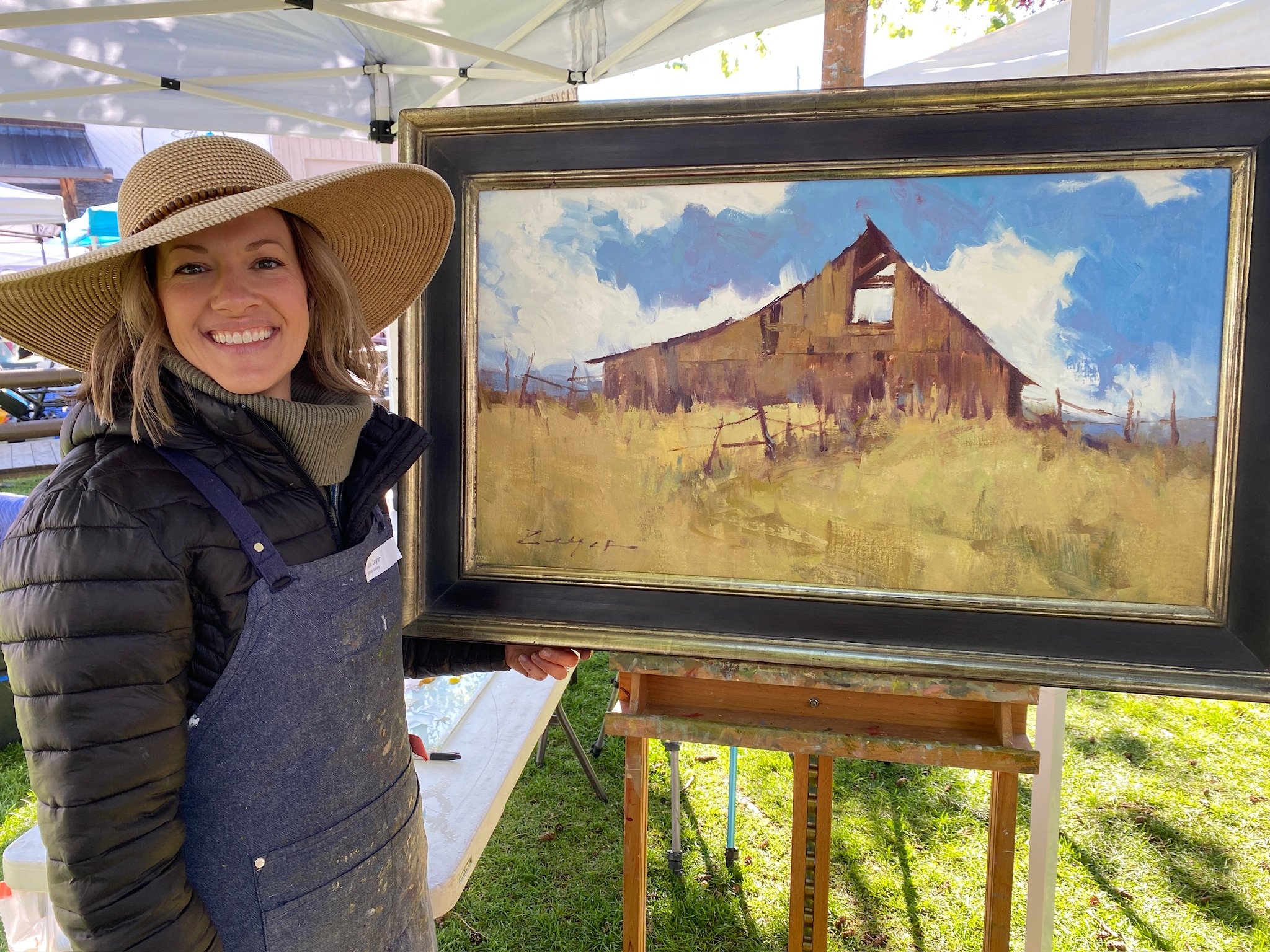 Landscape painter Allie Zeyer with her painting at the 2023 Jackson Hole Chamber of Commerce QuickDraw event