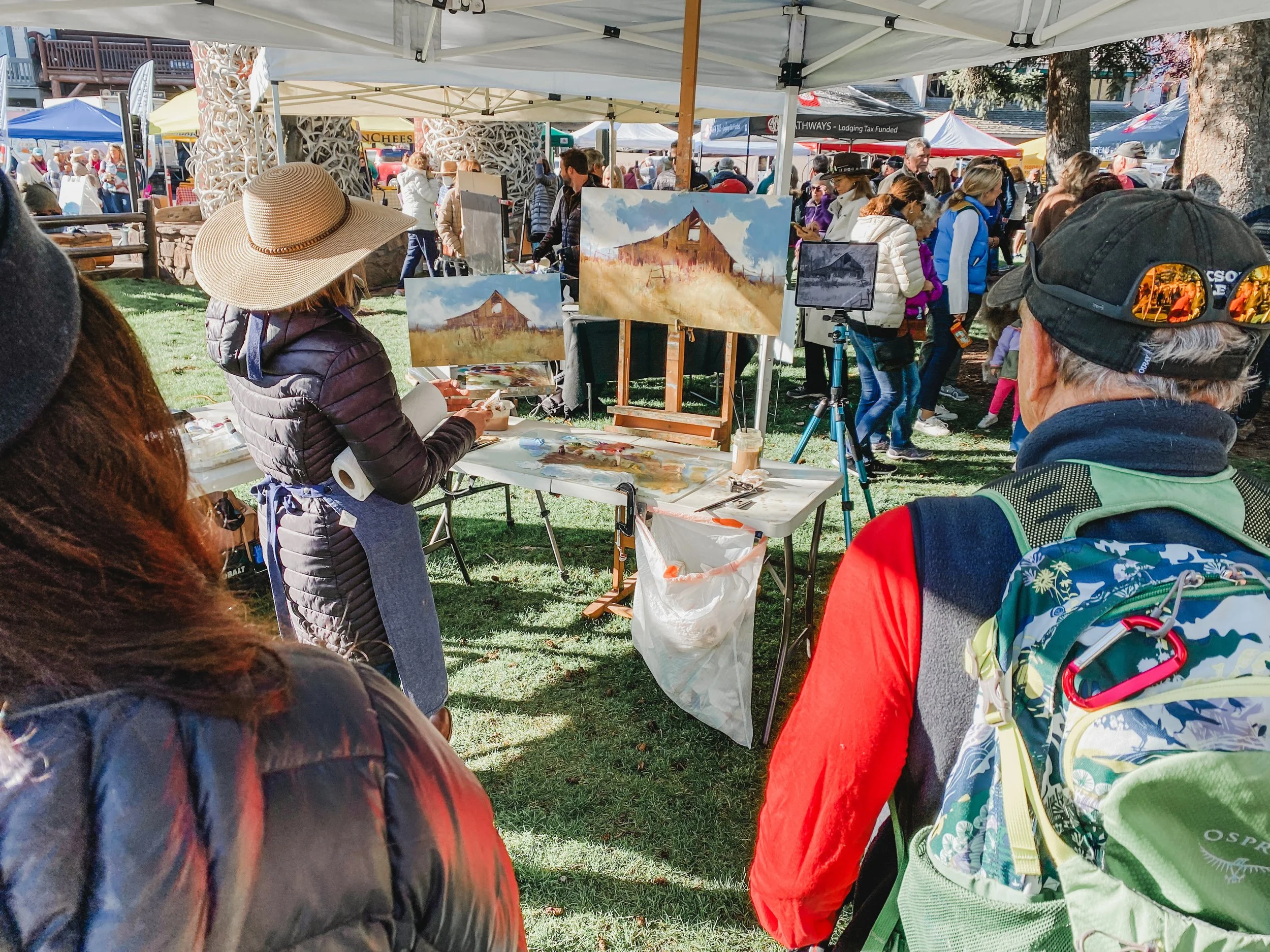 Allie Zeyer paints a landscape painting at the Jackson Hole QuickDraw 2023