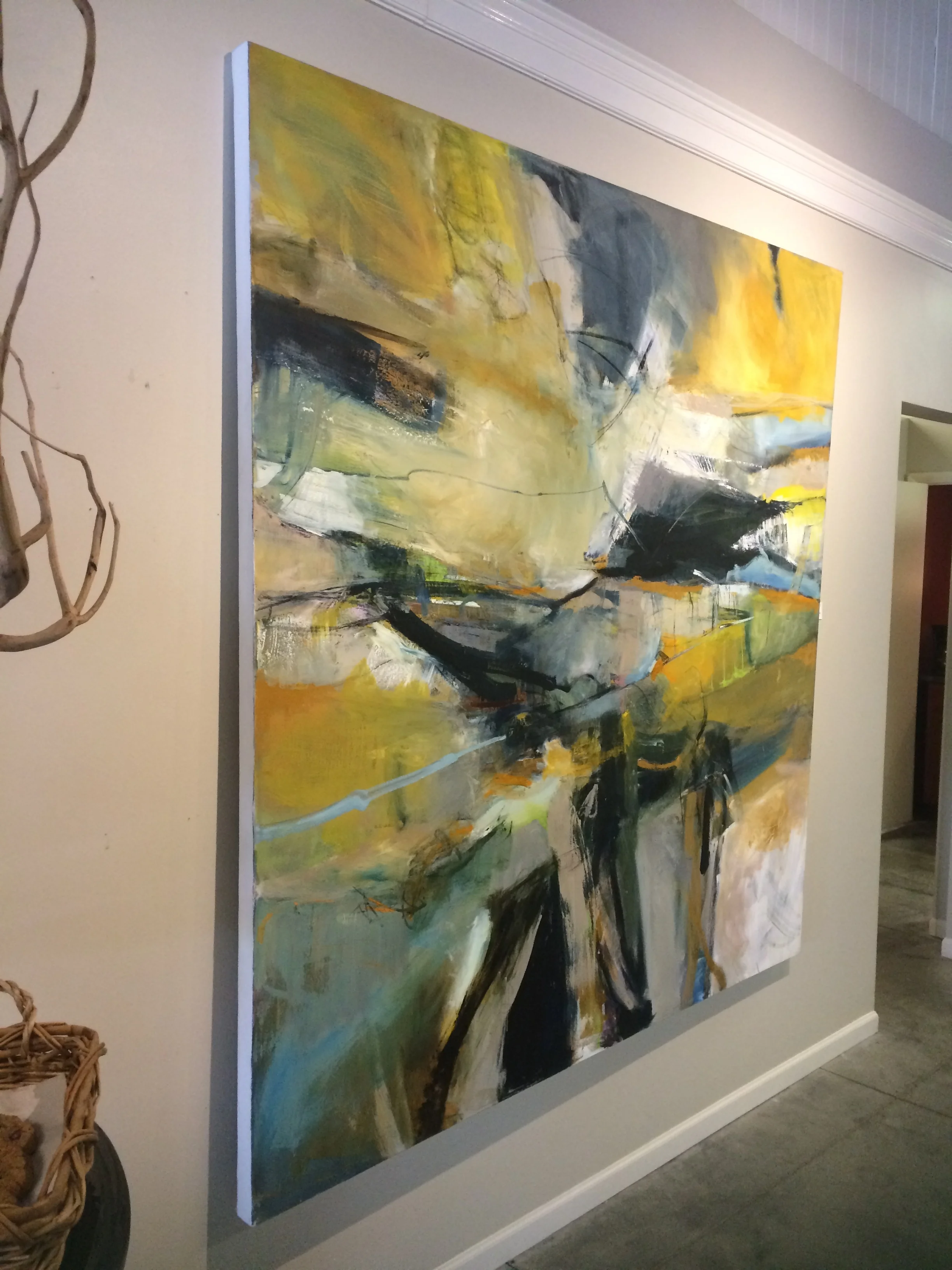 Unframed artwork, notice the warped stretcher bars not laying flat on the wall