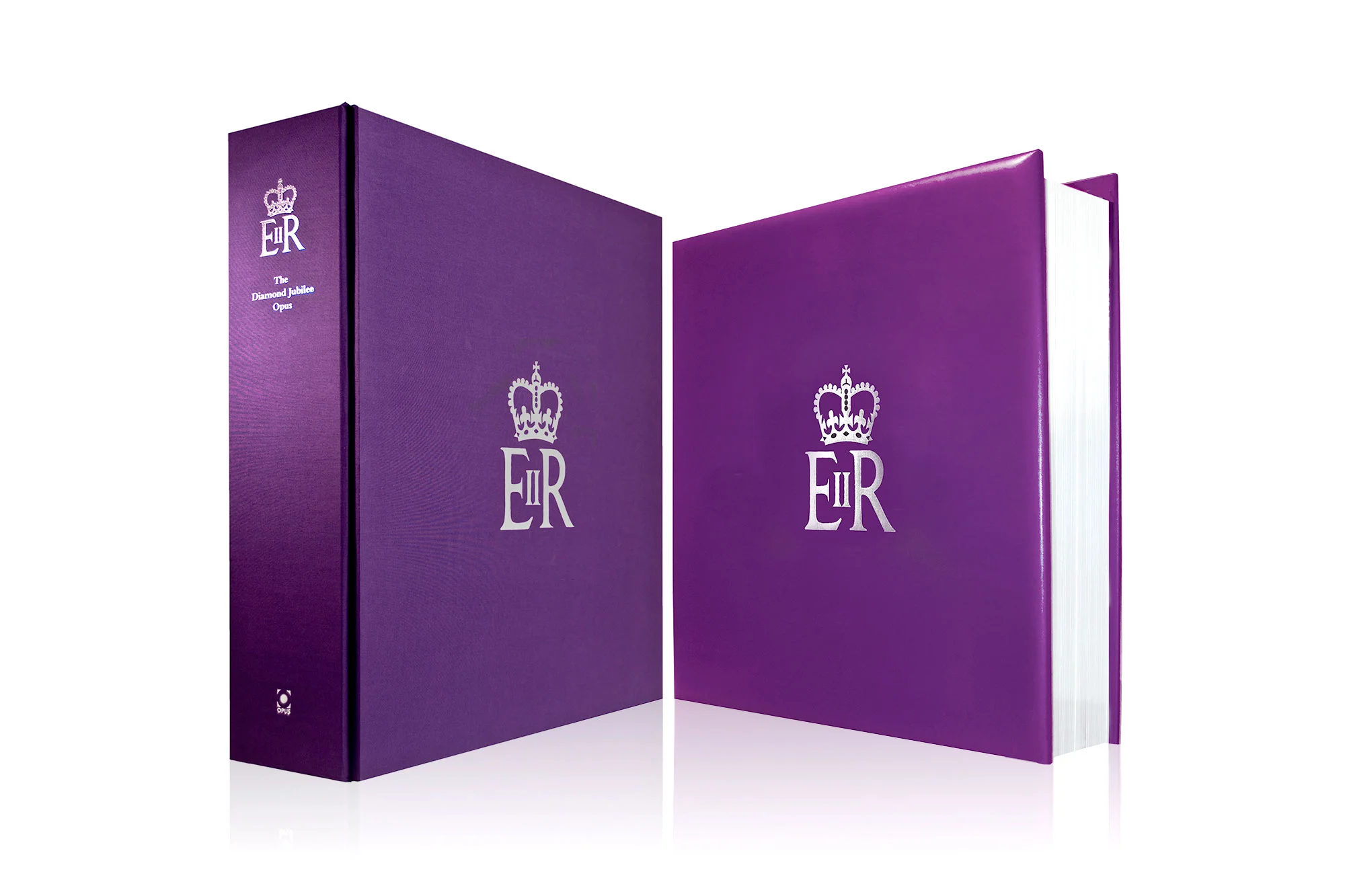 The book on the right and its protective case on the left, with the Royal Cypher foil stamped on the spine and the front. Design by Martin Sully.