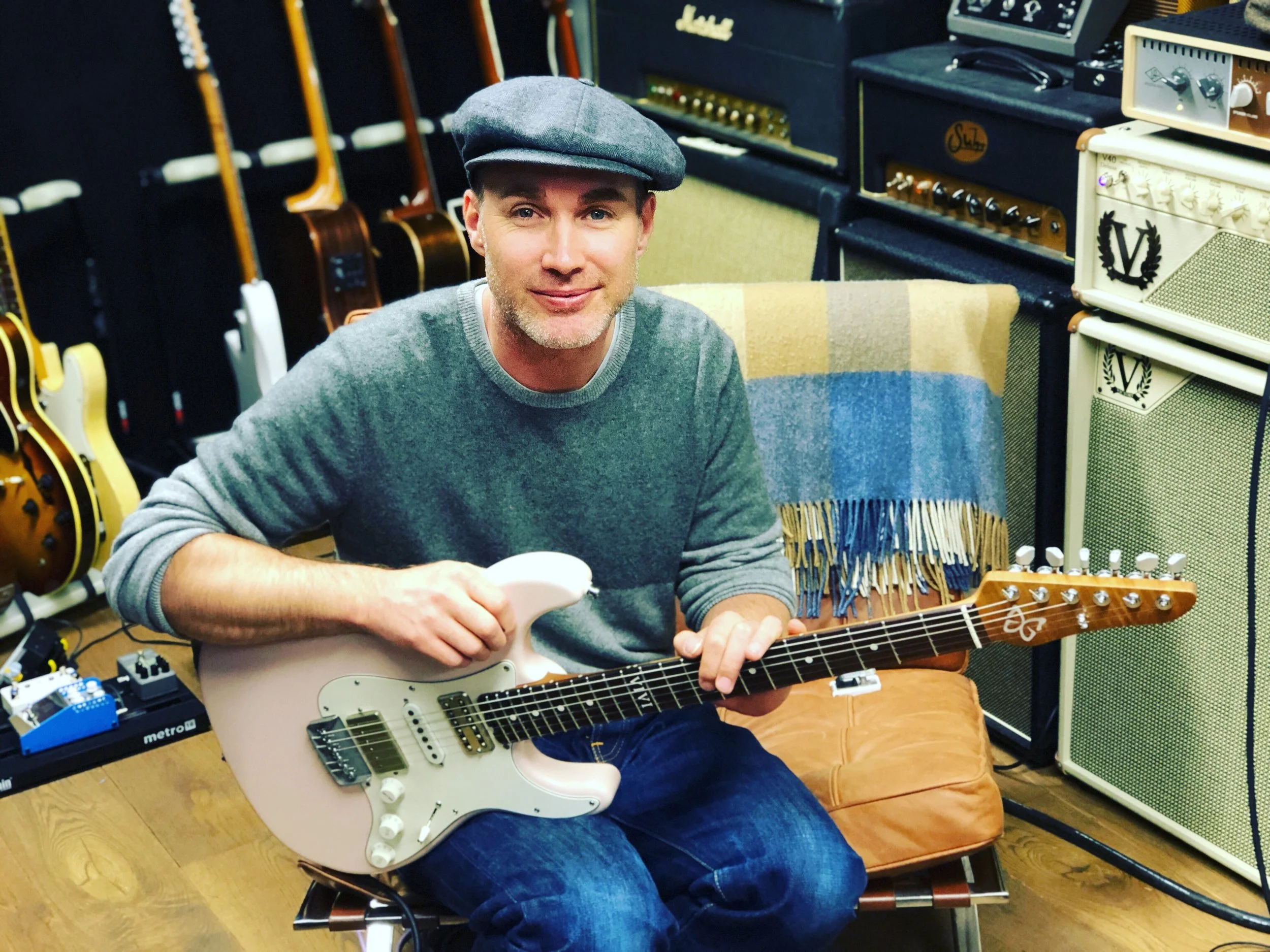 Justin in his filming/recording studio with his Shell Pink Emperor model - featuring RadioShop Pickups, a Mastery bridge and a 1/4 sawn, roasted Maple neck.