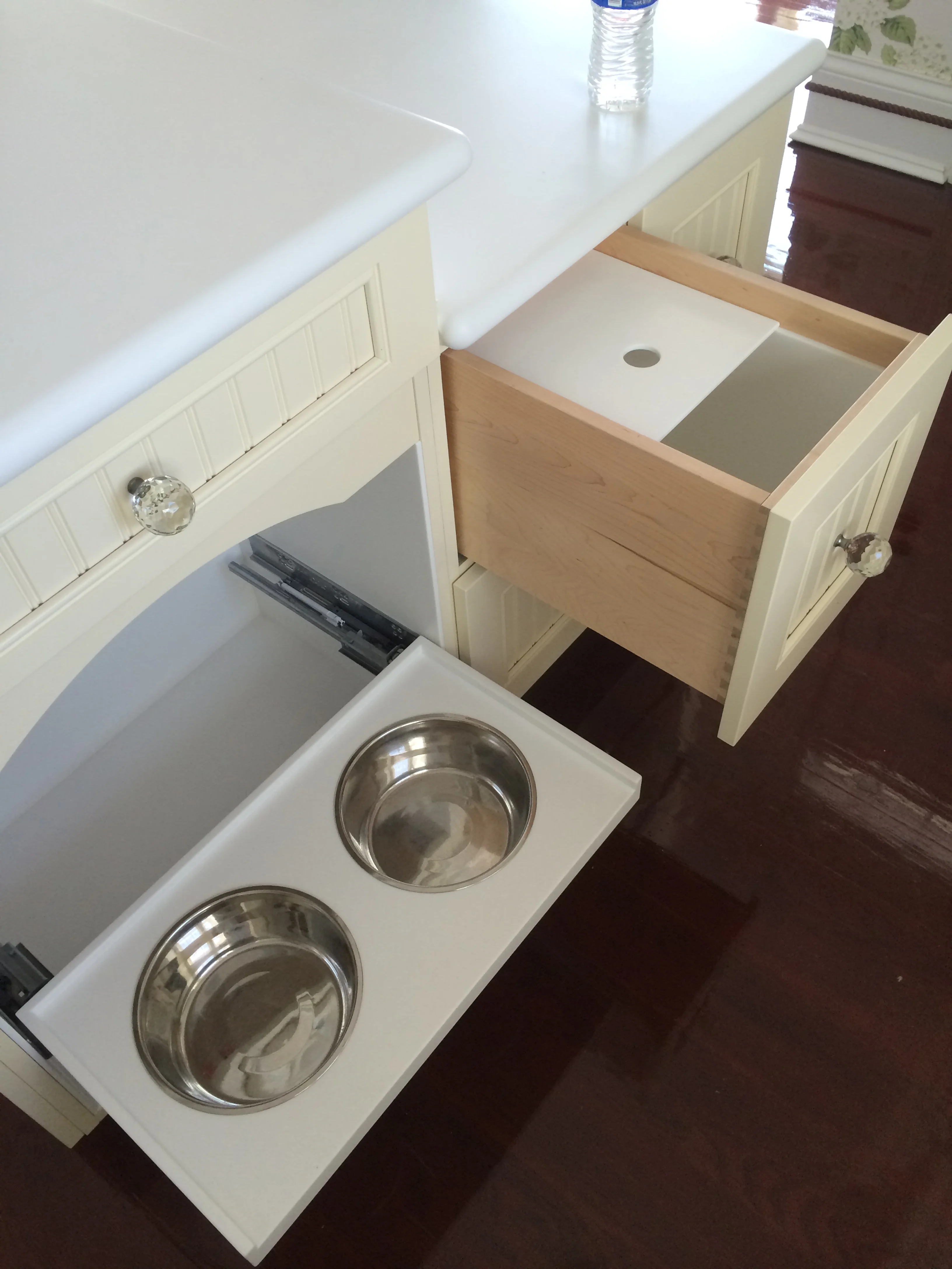  Corian Counter with Corian-Lined Cabinet and Drawers for Pet's Water and Food 