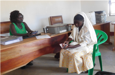 Janet, ALFI Fund beneficiary, discussing her loan needs with our Business Development Officer 