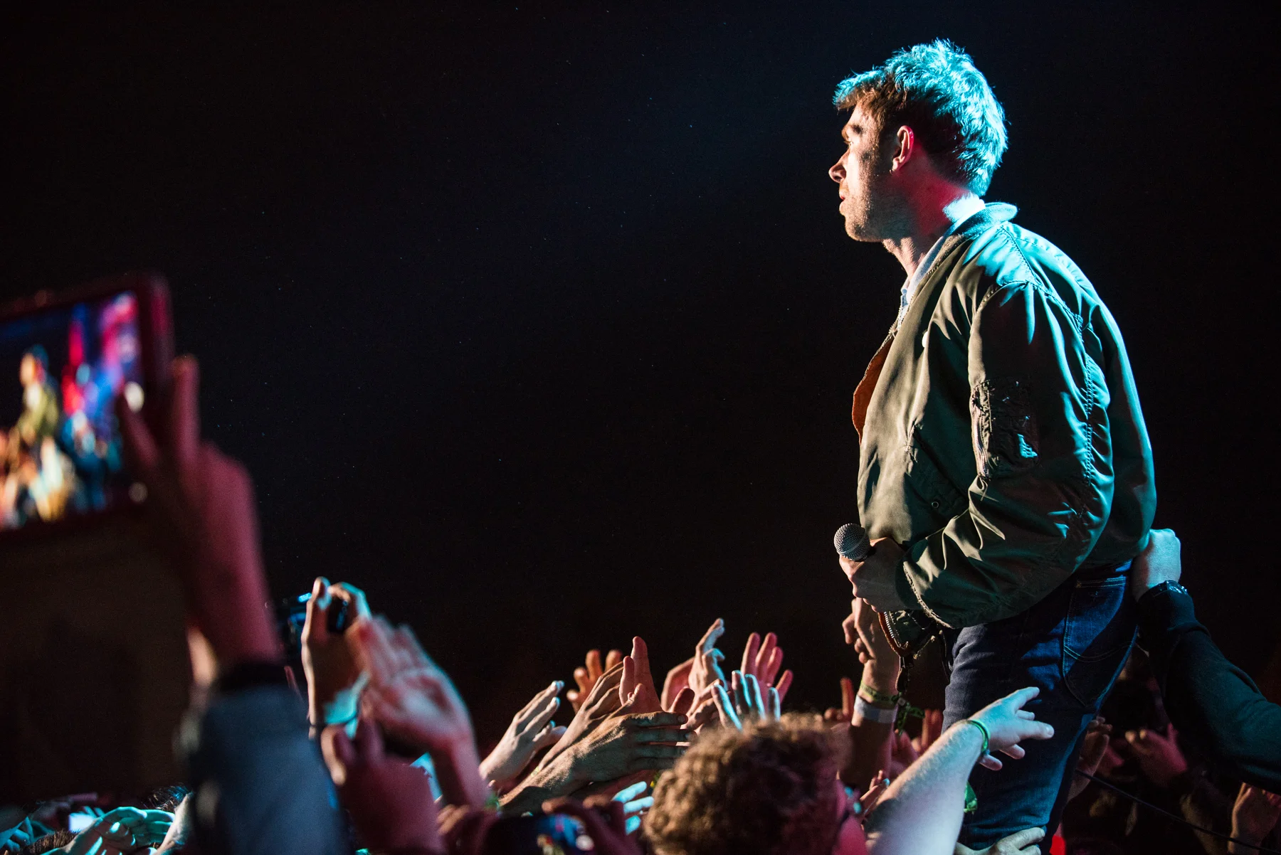 Blur's very own Alex James, stepping down from the main stage to get involved with his audience (Isle of Wight 2015)