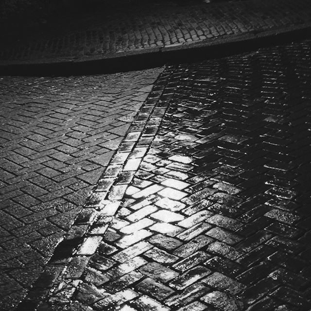 Amsterdam at night. Last night in Amsterdam nice walk in the rain. Surfaces so shiny in the lovely lamp light. #amsterdam #nightphotography #streetphotography #street #rain #blackandwhite #texture #iphone #photographywalks #phototour #cityscenes #cur