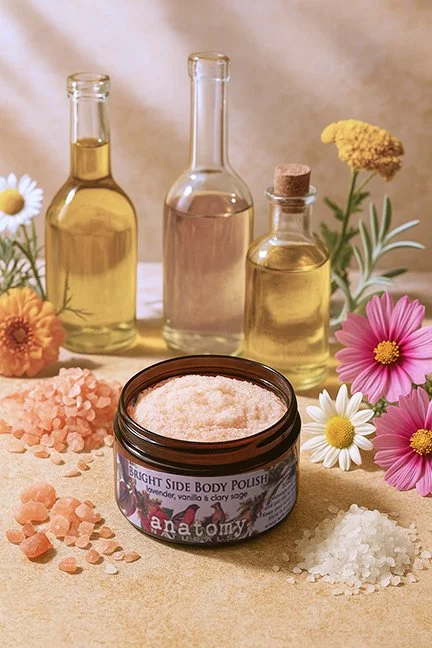 exfoliating body scrub jar with salt and oil ingredients