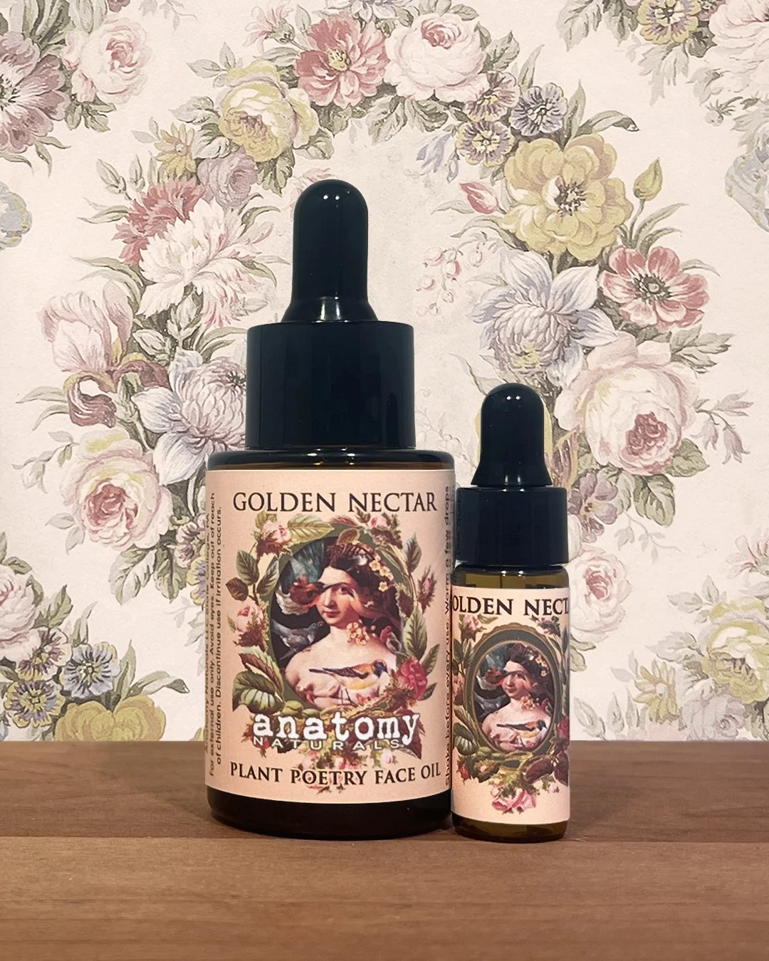 Golden Nectar face oil for dry and mature skin full size bottle with deluxe sample on wooden surface