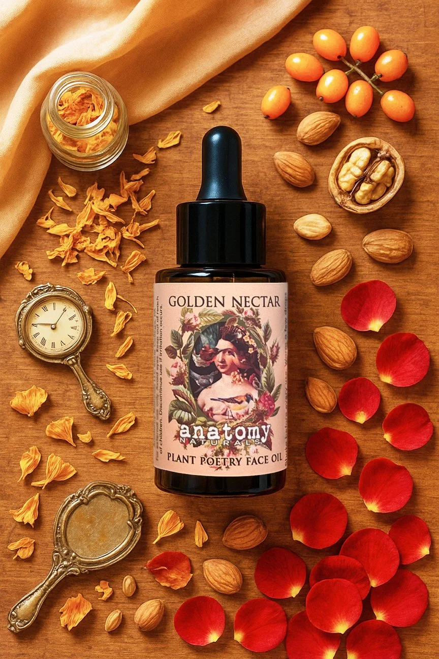 Golden Nectar botanical face oil for dry skin with almonds, rose petals, and botanical elements in warm flat lay