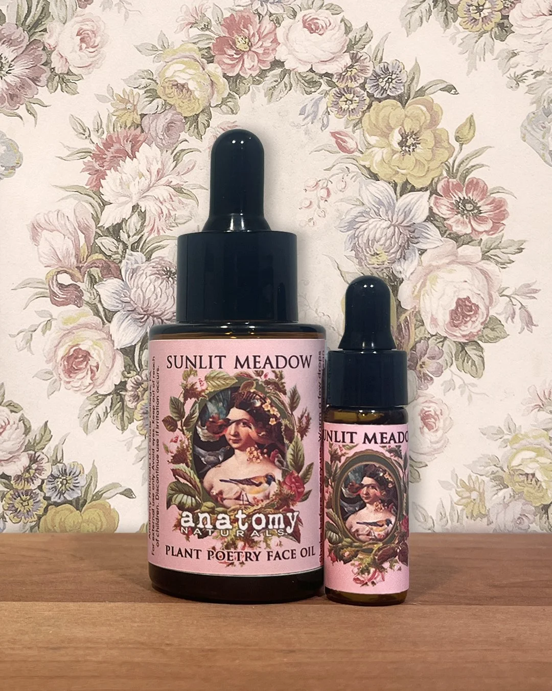 Sunlit Meadow face oil for combination skin full size bottle with deluxe sample on wooden surface