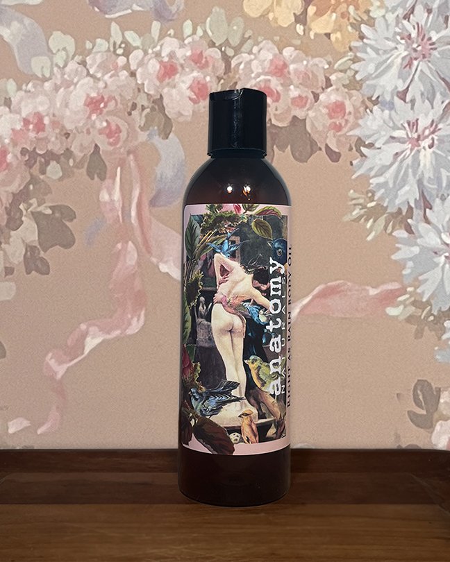 body oil for after shower bottle shown on floral background