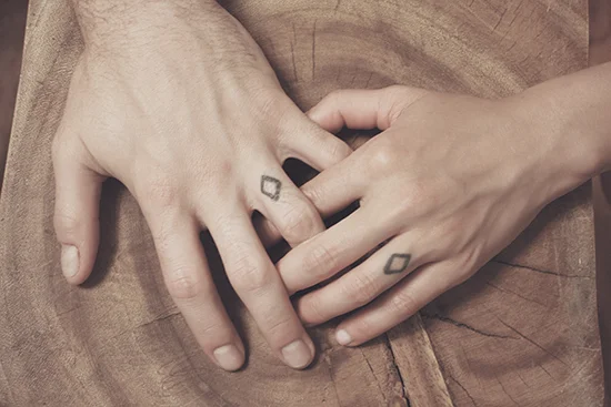 Morgan Le Maitre and Ryan Brunton chose commitment diamond tattoos instead of rings to accommodate their rock climbing lifestyle