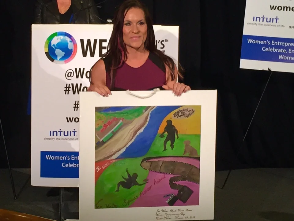 Dr. Jen Welter, the 1st female NFL coach with her Heart Map Award at the UN. 