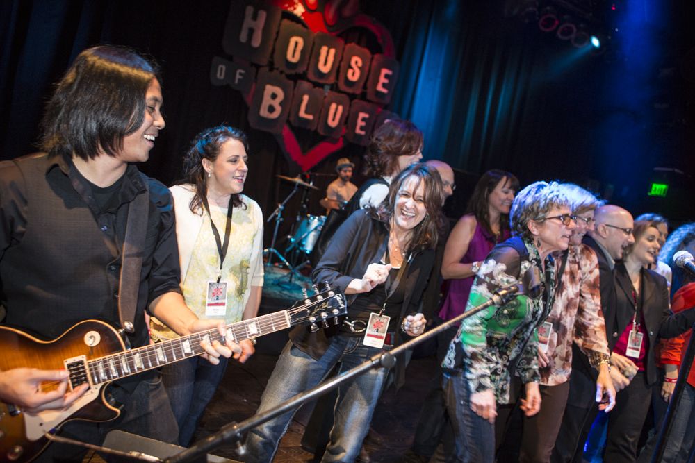 Rosh Roslin partying with a group of singers at a private party on the mainstage at House Of Blues Anaheim.