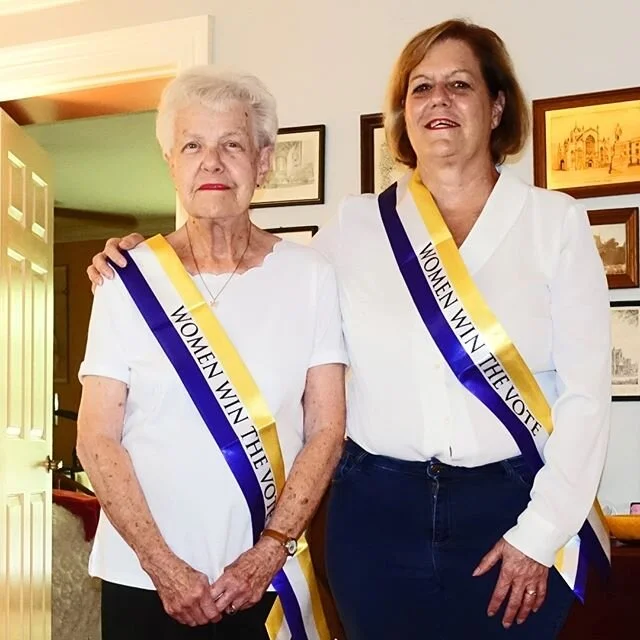 We are hoping you will join us as we kick off the museum&rsquo;s new Exhibit: Women Cast Your Vote, Celebrating the Suffrage Centennial by wearing a Suffrage sash and take a selfie photo and post it on our FaceBook page before June 28th. This is the day that the Texas legislature voted to ratify the Nineteenth Amendment in 1919. Texas was one the first states in the south to do so.
The suffrage colors were chosen by the leaders of the movement to create a recognizable and appealing impression of themselves. Their color scheme embodied their ideals. The purple stands for loyalty and white for purity. Yellow was chosen as a tribute to Kansas's state flower, the sunflower, where the first statewide suffrage referendum was held in 1867. Many women wore white dresses with their sash, and suffragist white became the public uniform of the movement.
You can purchase our Suffrage Sash online at https://www.heritagesociety.org/suffrage-merch and select pickup/shipping. You will have plenty of op