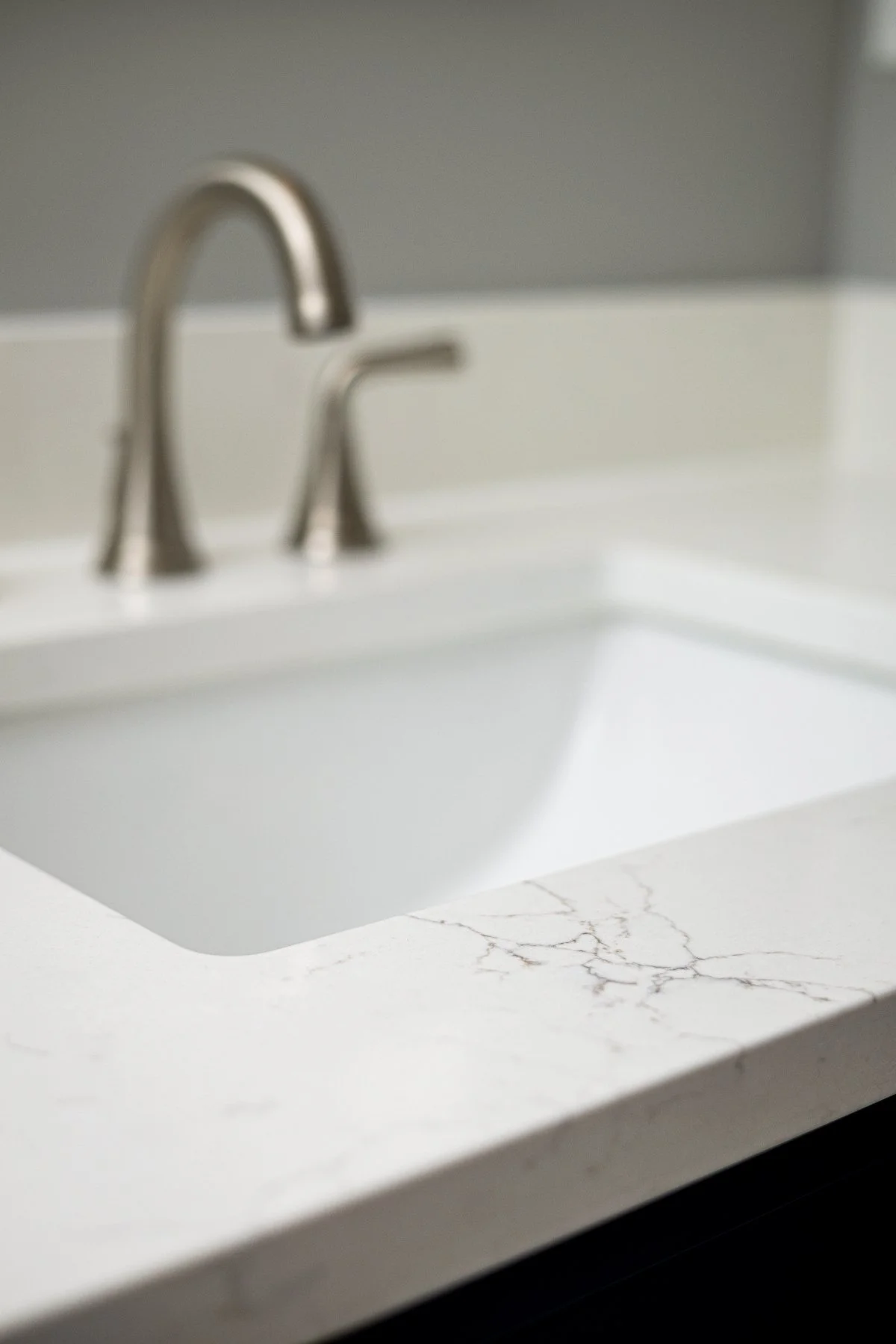 bathroom 055 quartz-countertop-undermount-sink-brushed-nickel-faucet-close-up.jpg.jpg