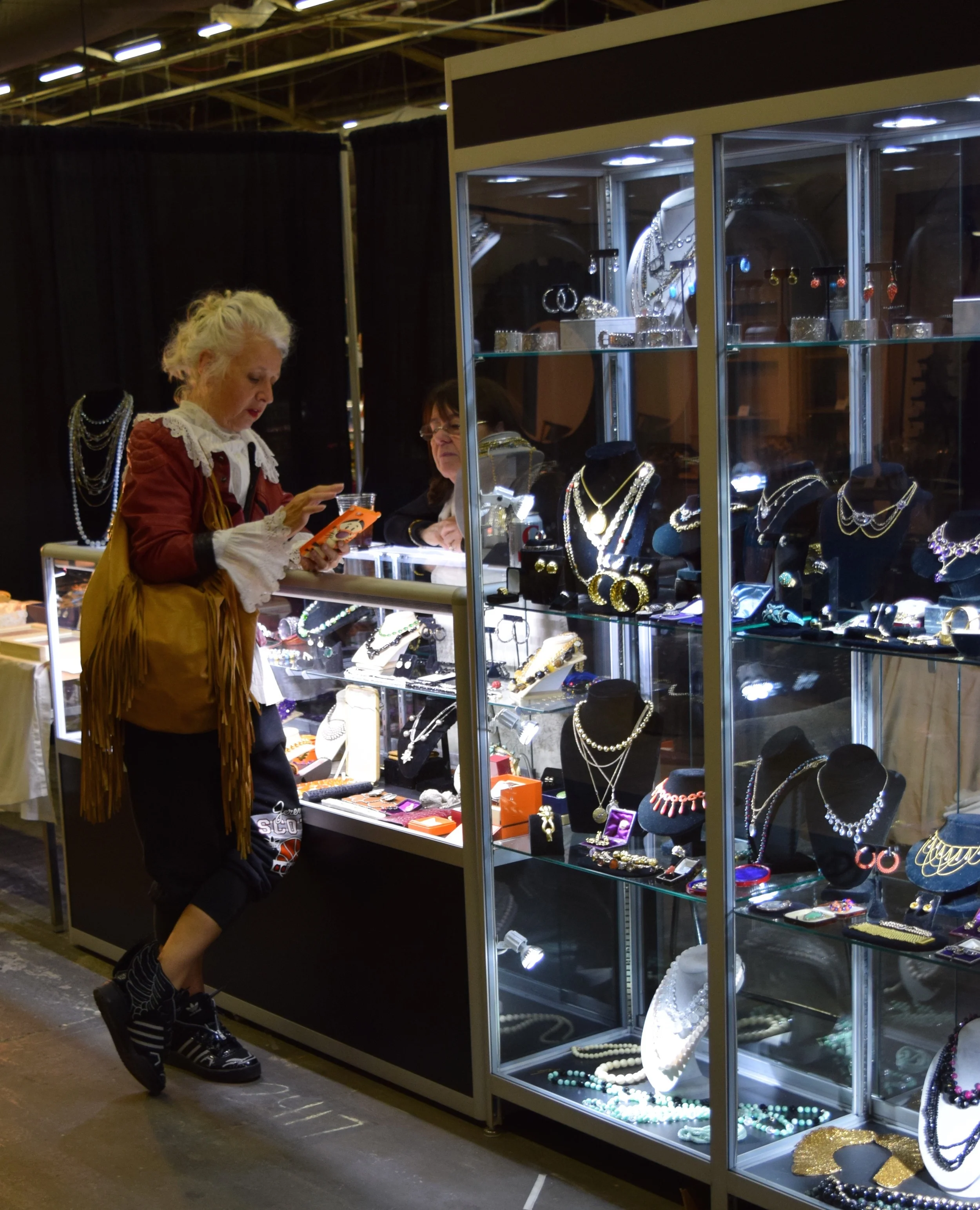 Check out her winged sneakers. No doubt she's calculating the price of things with her Tony the Tiger covered phone.