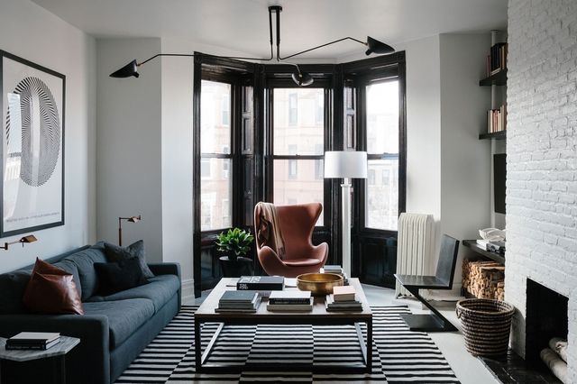 This eclectic room I chose from my Pinterest page mixes contemporary and modern furniture and lighting beautifully. {Just an FYI totally off topic, I hate seeing more than two stacks of books on a table! There are so many other items that can be used when styling and putting the decor details together! That is the one thing I would change in this interior.} (Click picture to go to link) 